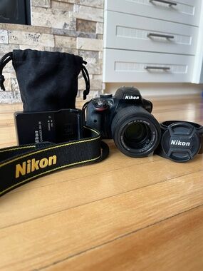Nikon Black DSLR Camera with Yellow-Trim Strap